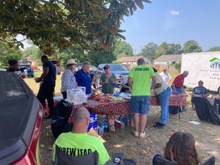 Serving a meal at the Habitat building site