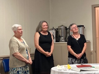 Ladies assisting with the installation dinner