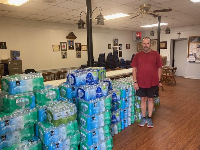 Sam, GK from St. Joseph bringing water to our hall for pickup