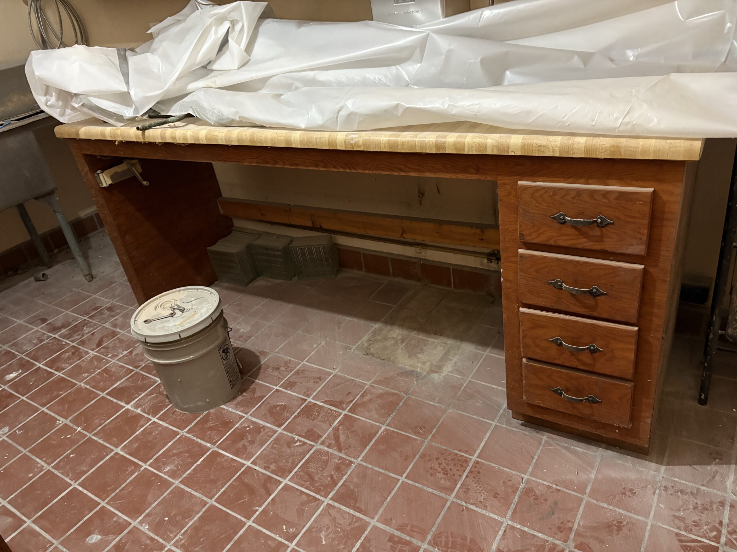 one of the kitchen lower cabinets